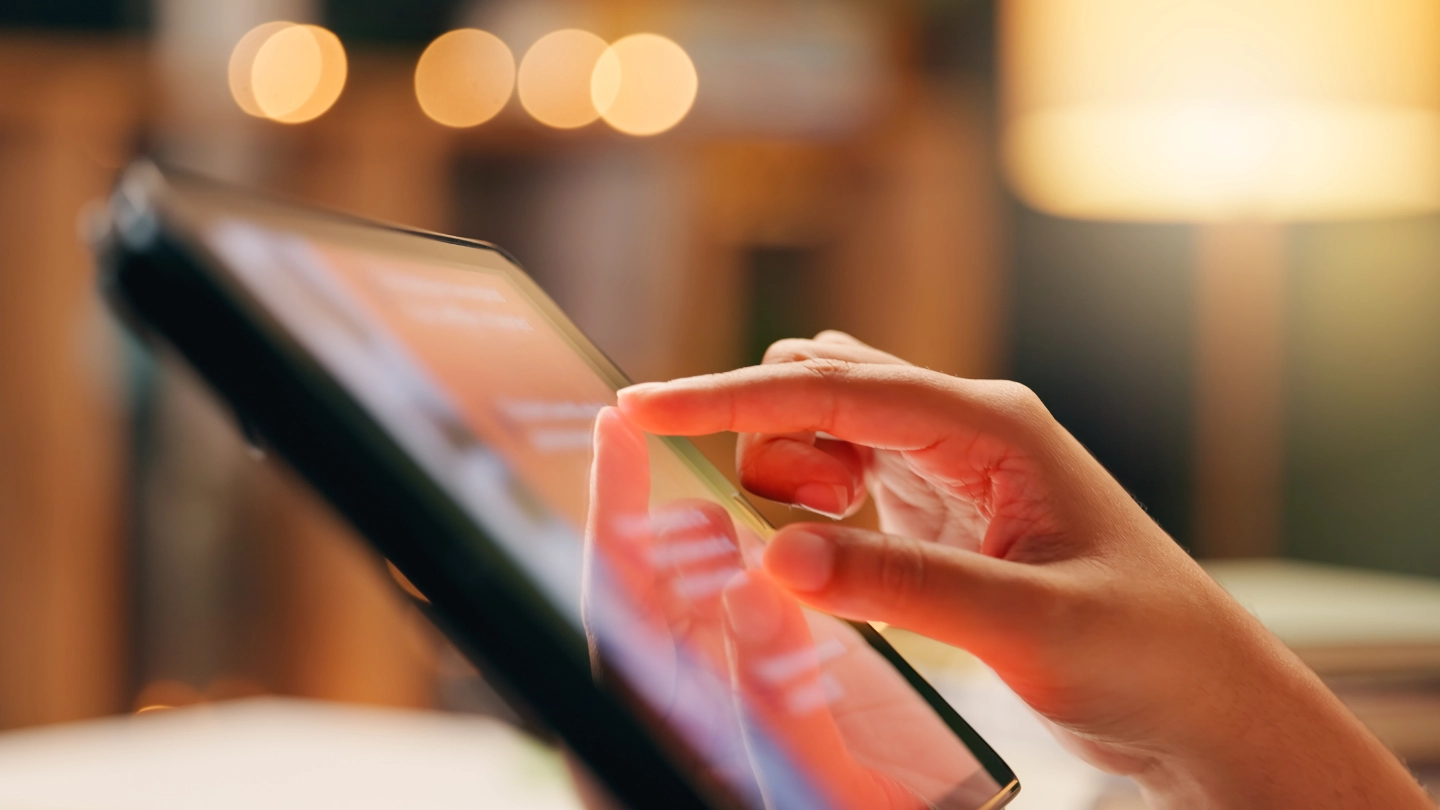 Hand touching tablet