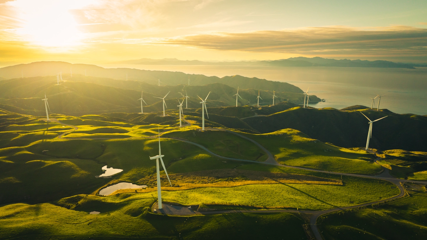 Collection of wind turbines on rolling hillside image